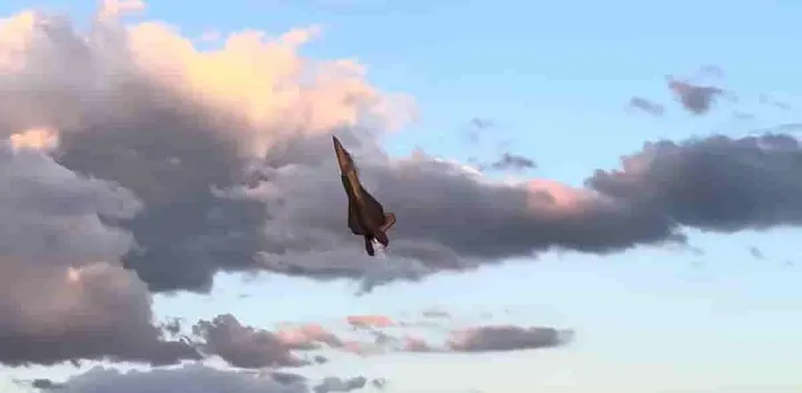 Military jet flying straight up