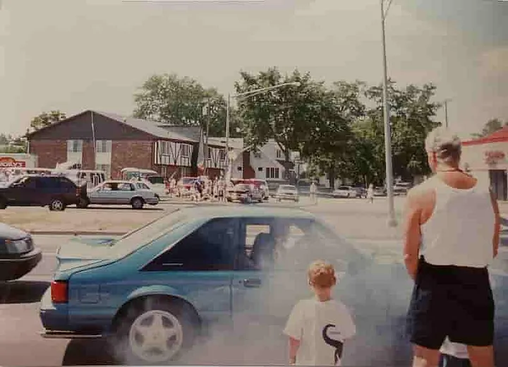 Car 'burning rubber' as they participate in The Dream Cruise