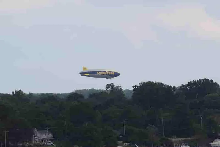 Goodyear Blimp just above the treetops