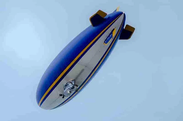 The bottom of the Goodyear Blimp as it nears the ground.