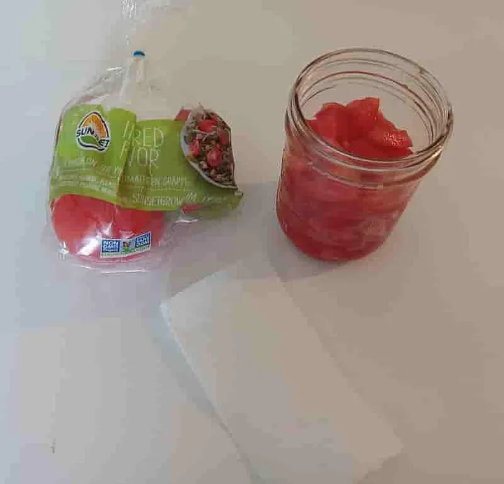 Chopped tomatoes in a mason jar