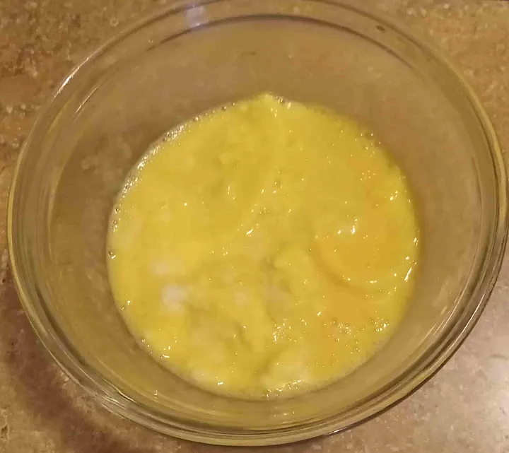 Partially mixed bowl of scrambled eggs