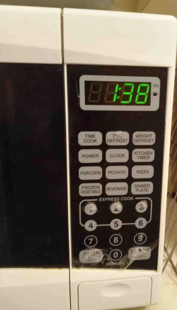 Image of a microwave clock. Time is 1:38