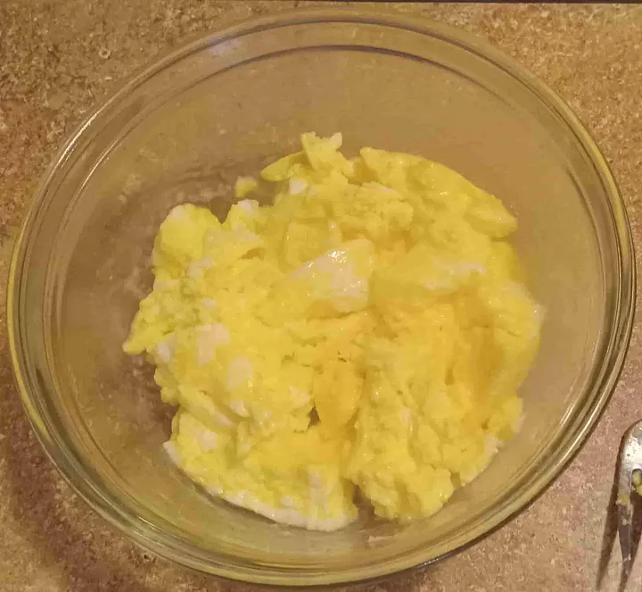 Cooked scrambled eggs in a bowl